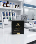 A black box of Genetic Labs SLU-PP-332 5 MG liquid supplement stands on a white laboratory counter, with pipettes, centrifuges, and other lab equipment blurred in the background.